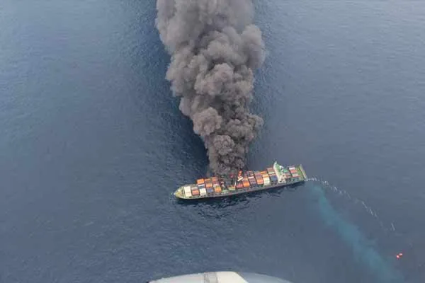 A ship on fire in the middle of the ocean kerala