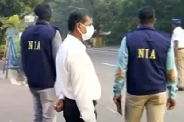  NIA officials inspect in front of Guindy Governor House