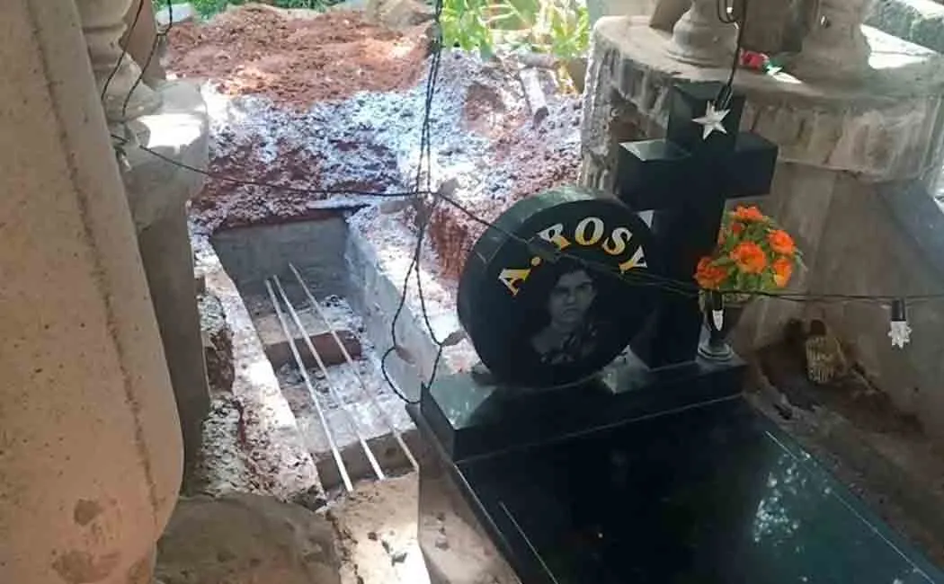 The body of an old woman buried in a grave she had built for herself!