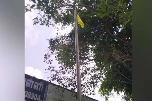Vanniyar Sangam flag on the national flag pole in Kaattumannarkovil government school 
