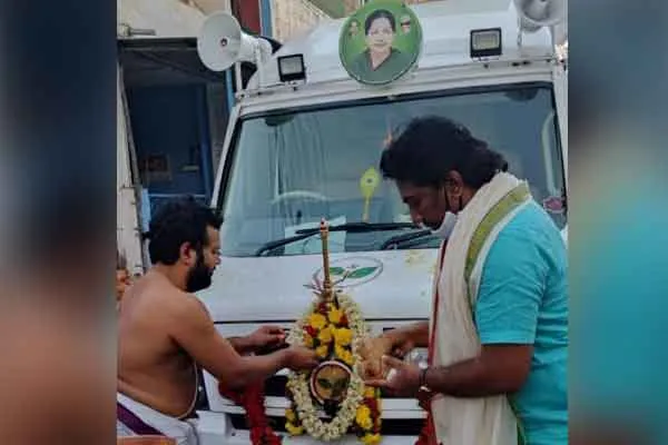 OPS Son who made special pooja for campaign van in Tirupati 