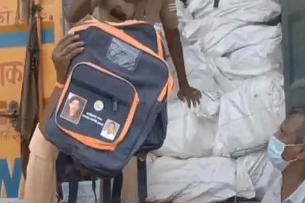 Is there money in the bags with the picture of the Chief Minister? Container  