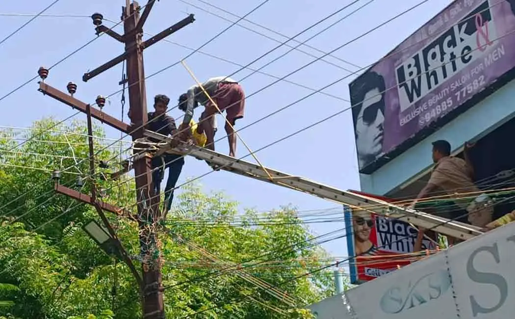 Two people working on a power pole were injured in an electric shock  