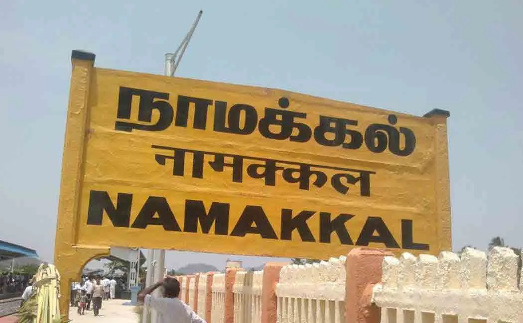 In front of the District Collector's office, the village assistant sat on the ground 
