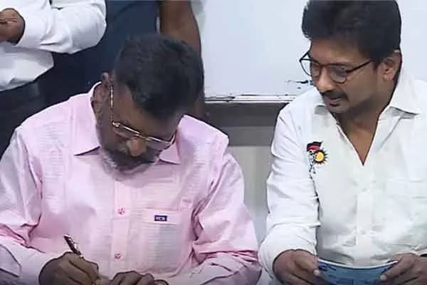 Minister Udayanidhi Stalin receiving the signature from Thirumavalavan