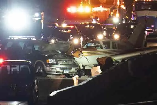 minnesota flight lands on road and crashes suv