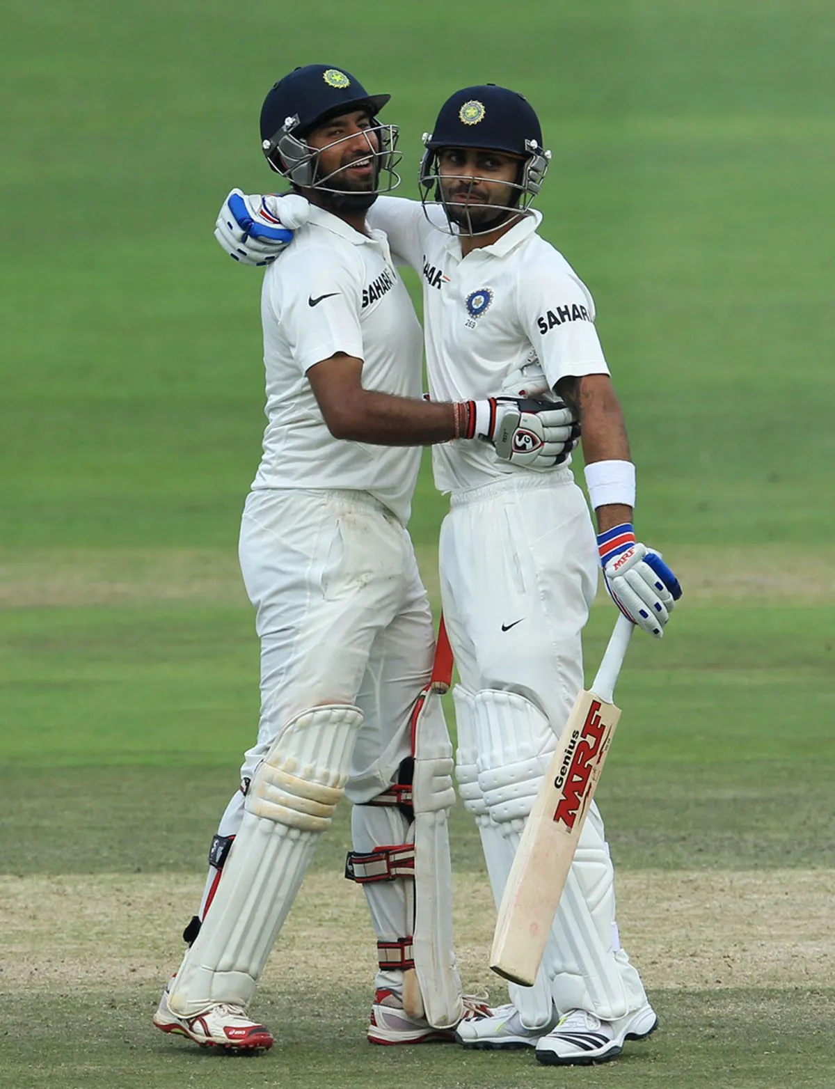 Cheteshwar Pujara embraces Virat Kohli after bringing up his hundred, South Africa v India, 1st Test, Johannesburg, 3rd day, December 20, 2013