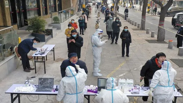 Under China's zero-COVID policy, people forced to move to quarantine camps,  live in metal boxes