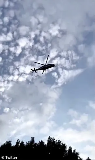 An AgustaWestland AW109 medical helicopter flying from San Diego is seen above getting ready to land onto the roof of Keck Hospital in East Los Angeles on Friday afternoon
