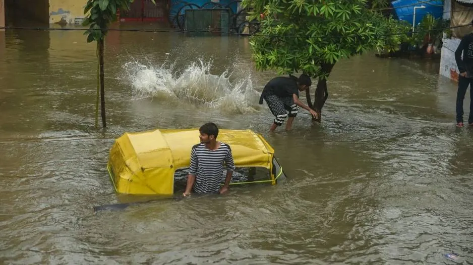 Due to heavy rain float away Auto Rickshaw
