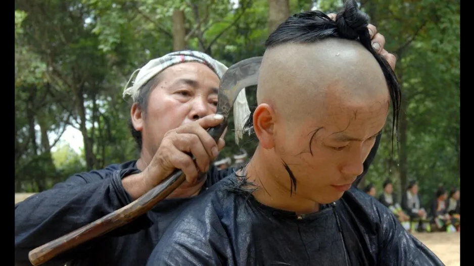 Werid tradition, men get haircut from sickle