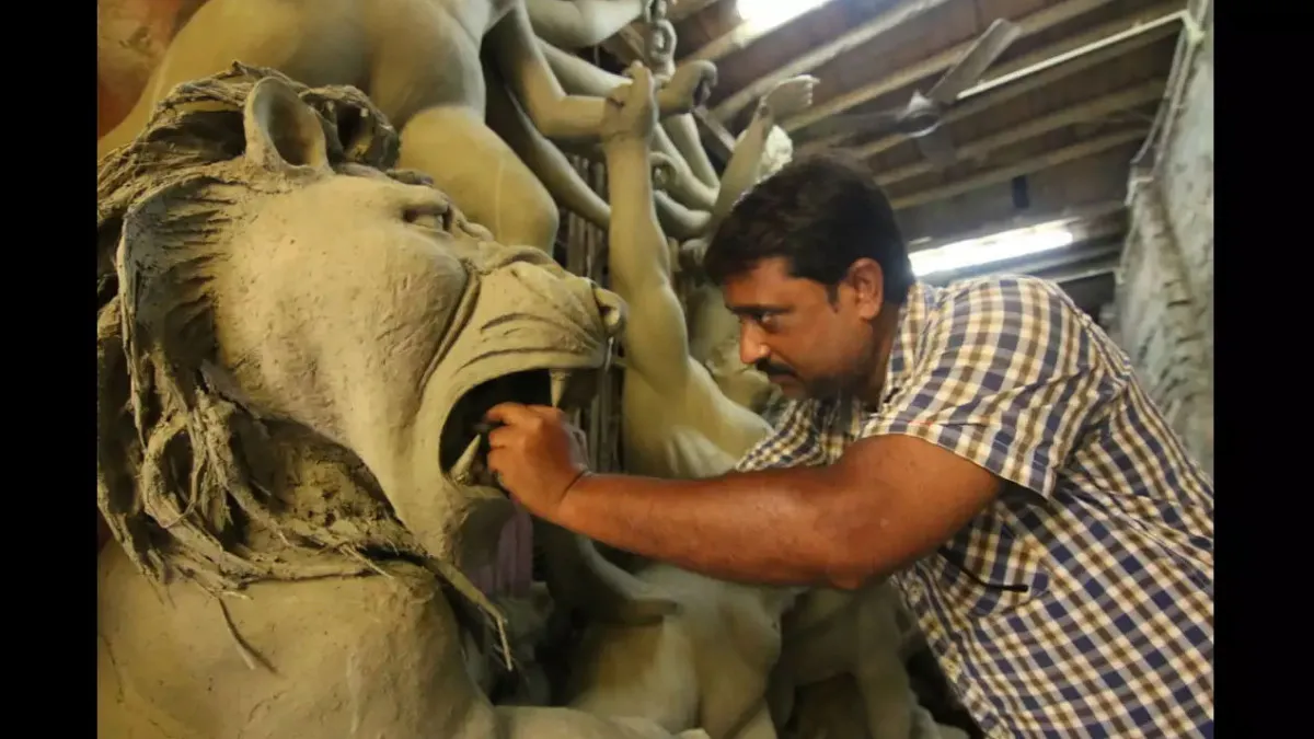 Why the holy idol of the goddess Durga made of clay in the brothel