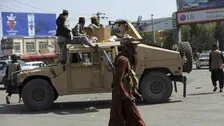 Taliban open fire as hundreds of Afghans take to streets to support national flag