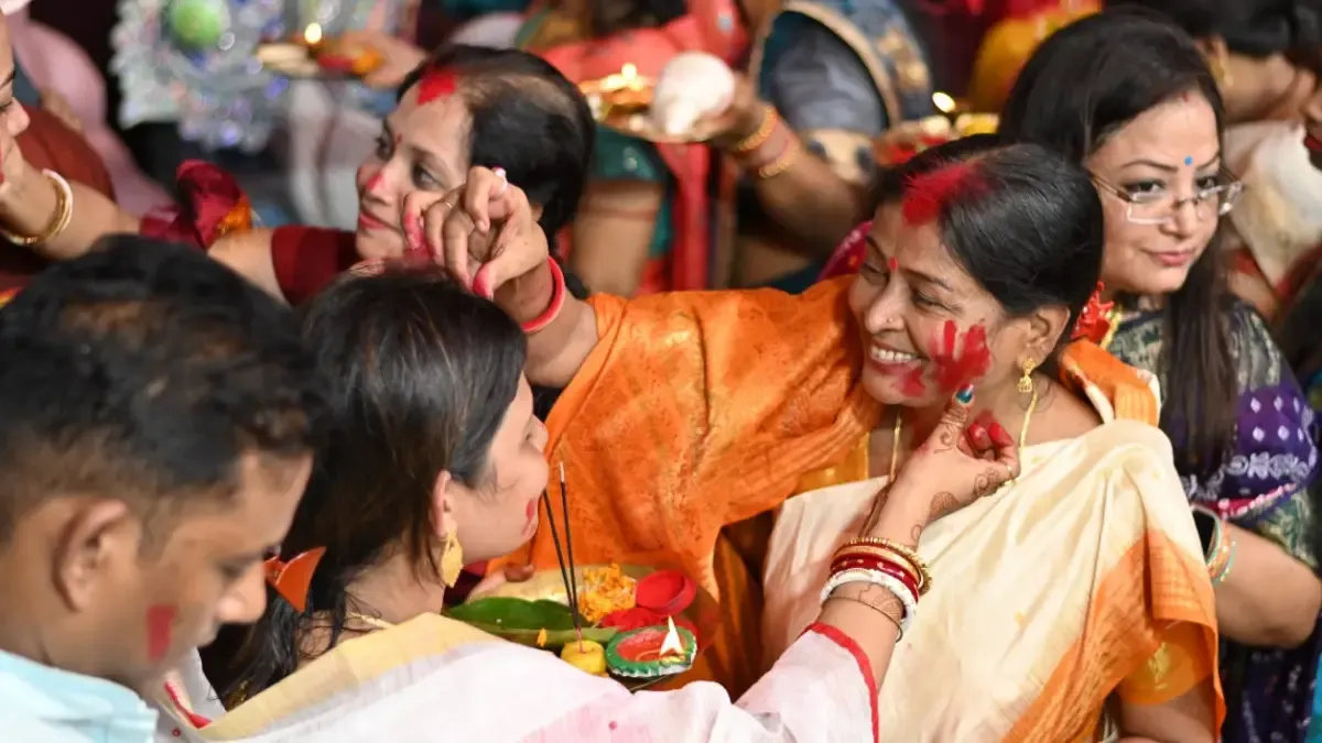 Women in Balasore's Suelpur Durga Mandap play Sindur Khela