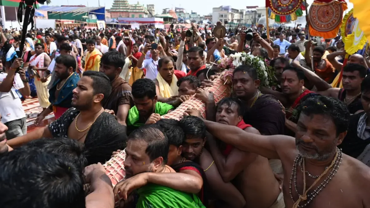  Lord Sudarshan being escorted to Debadalana chariot 