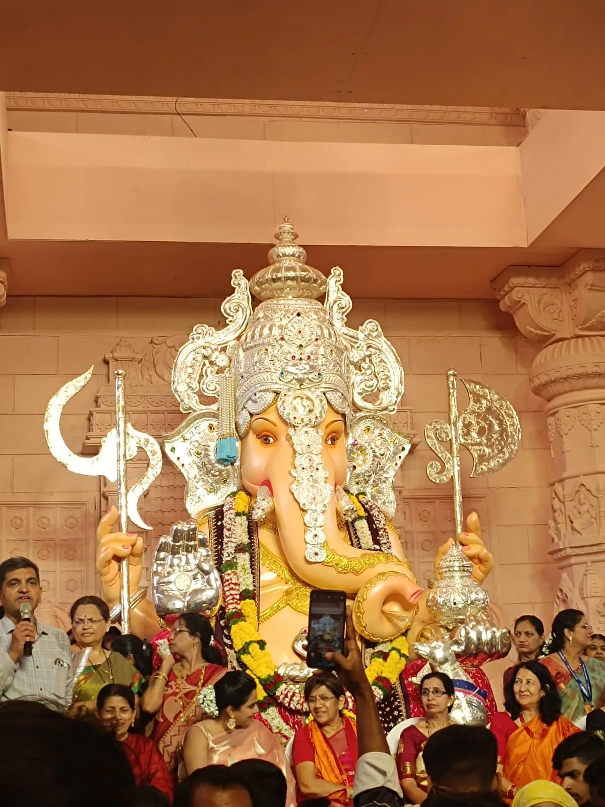 Women from the community being felicitated at the Tulsi Baug puja