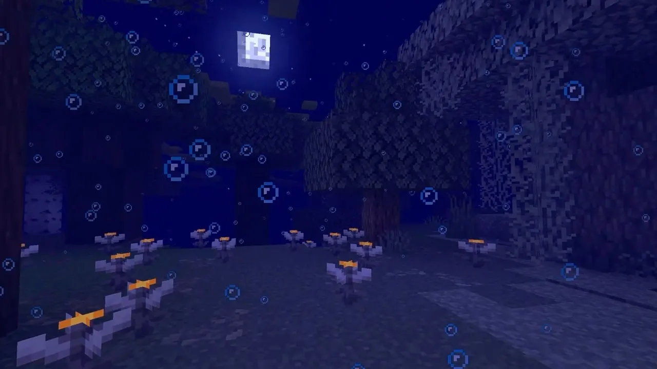 Pale garden biome that has blue fog, and bubble particles that has been modified with a data pack.