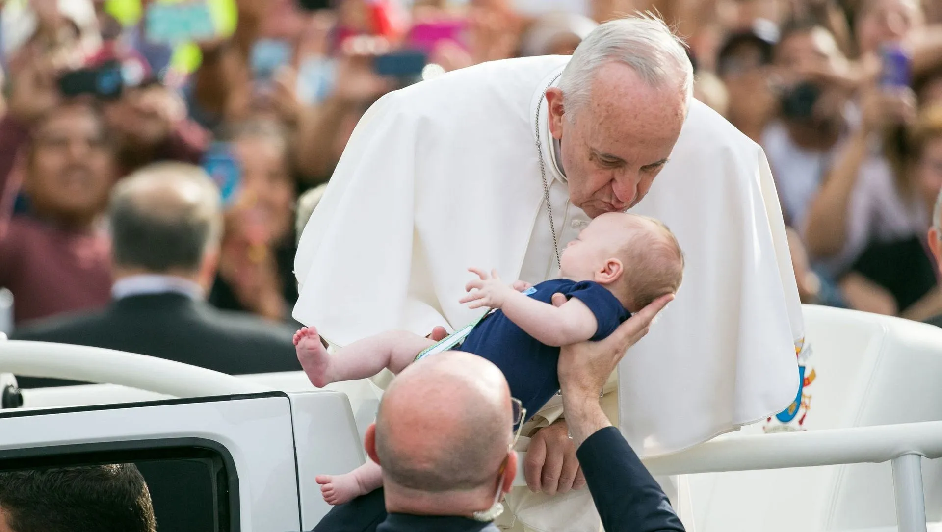 Pope Francis kissing babies