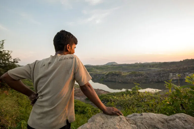 A resident overlooks a coal mine in Jharkhand. A just energy transition, in the context of green jobs, stresses on ensuring that the shift to a low-carbon economy is fair to all workers and communities. Image by Srikant Chaudhary/Mongabay.