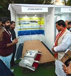 A group of men standing around a boothAI-generated content may be incorrect.