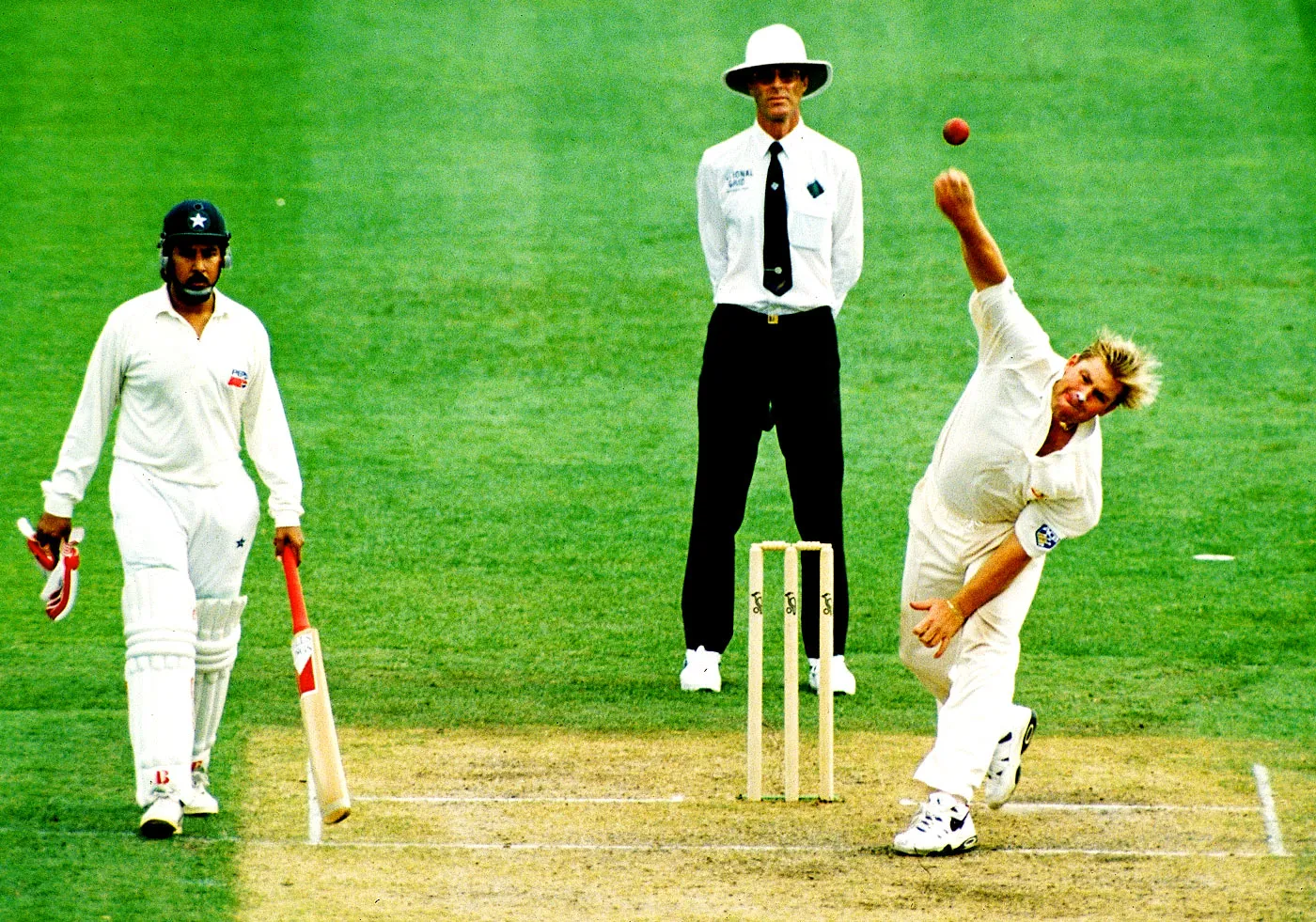 Shane Warne bowls