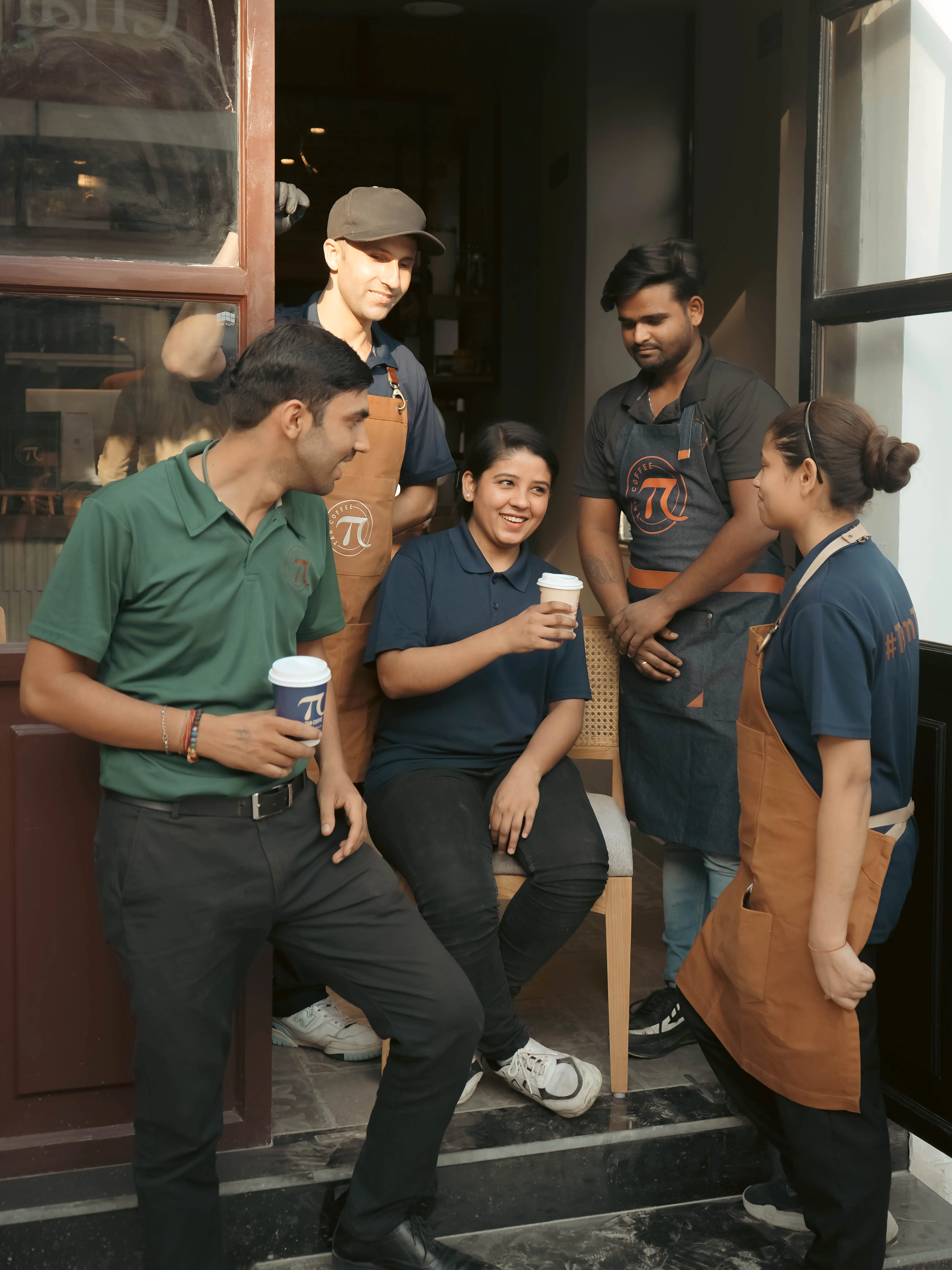 Staff members of a Tan Coffee outlet