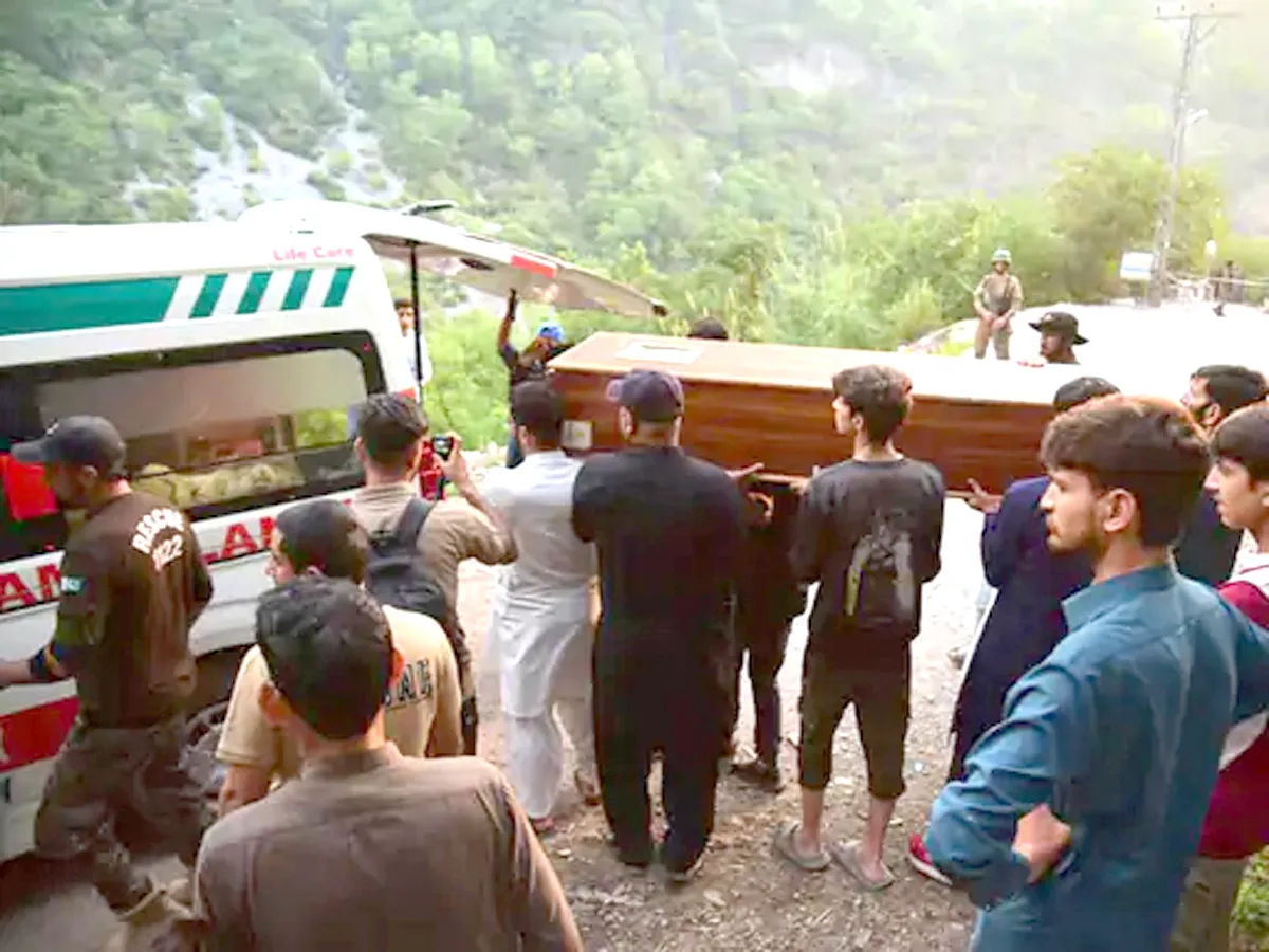 Rescue team members placing a body