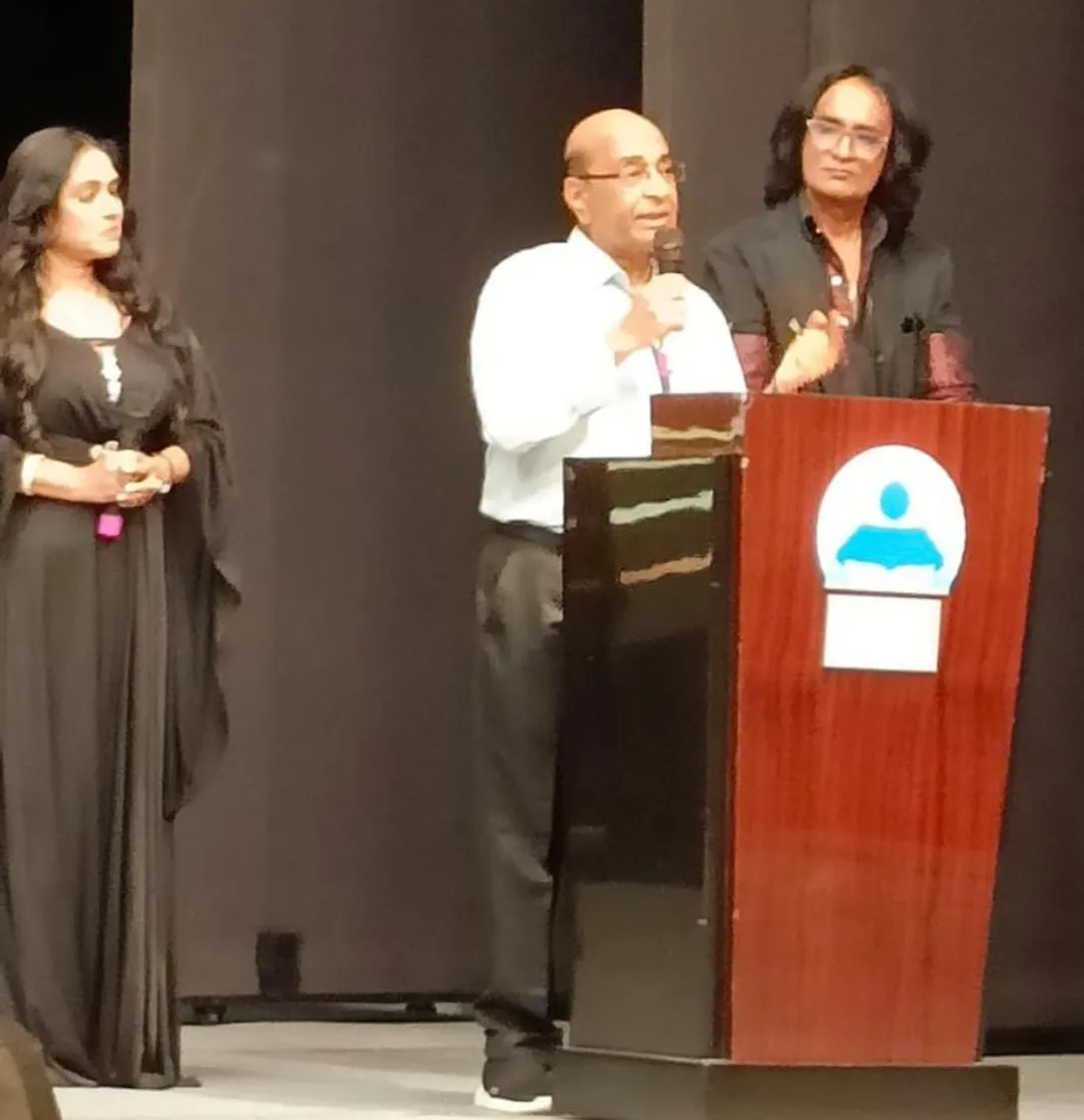 Babubhai Thiba addresses the audience as comperes Nita B and Zakir K  also listen