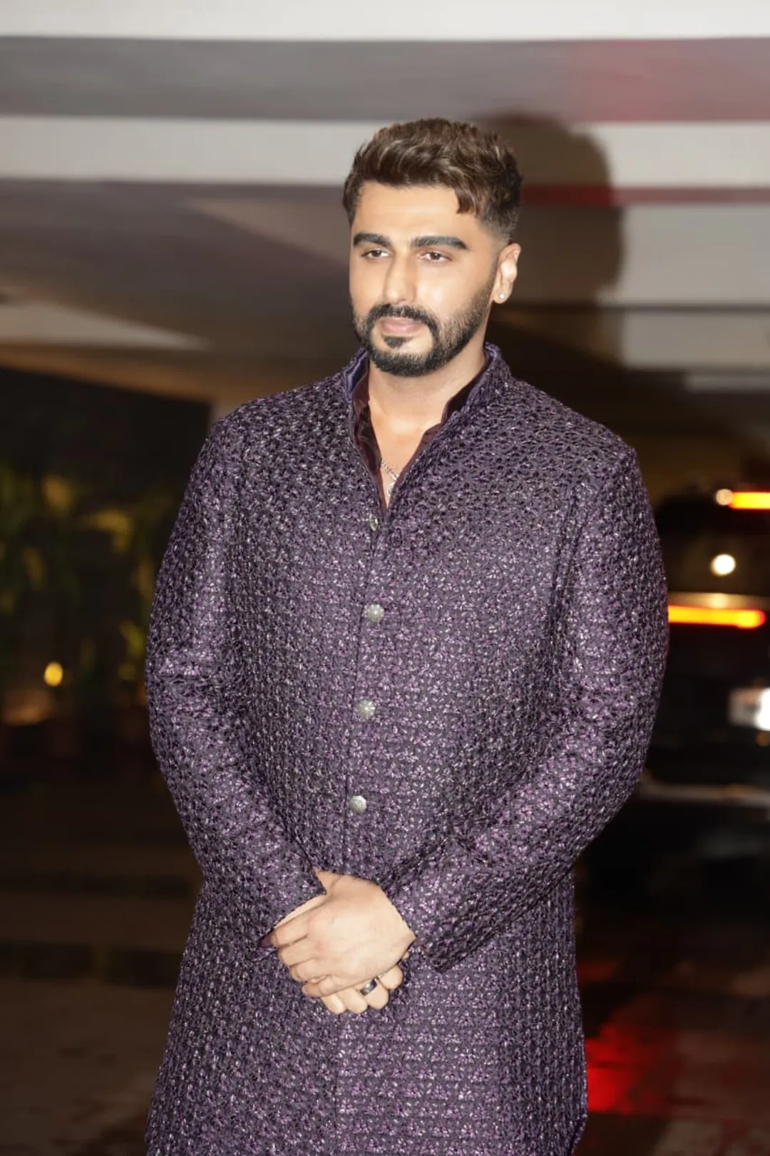 Arjun Kapoor appeared in front of the paps at his sister's engagement, dressed up. Fans are loving his dashing style in the viral photos. Arjun Kapoor looks incredibly handsome in a stylish purple kurta.