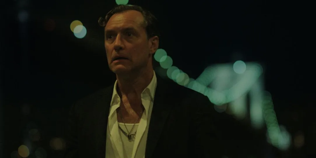 man standing outdoors at night