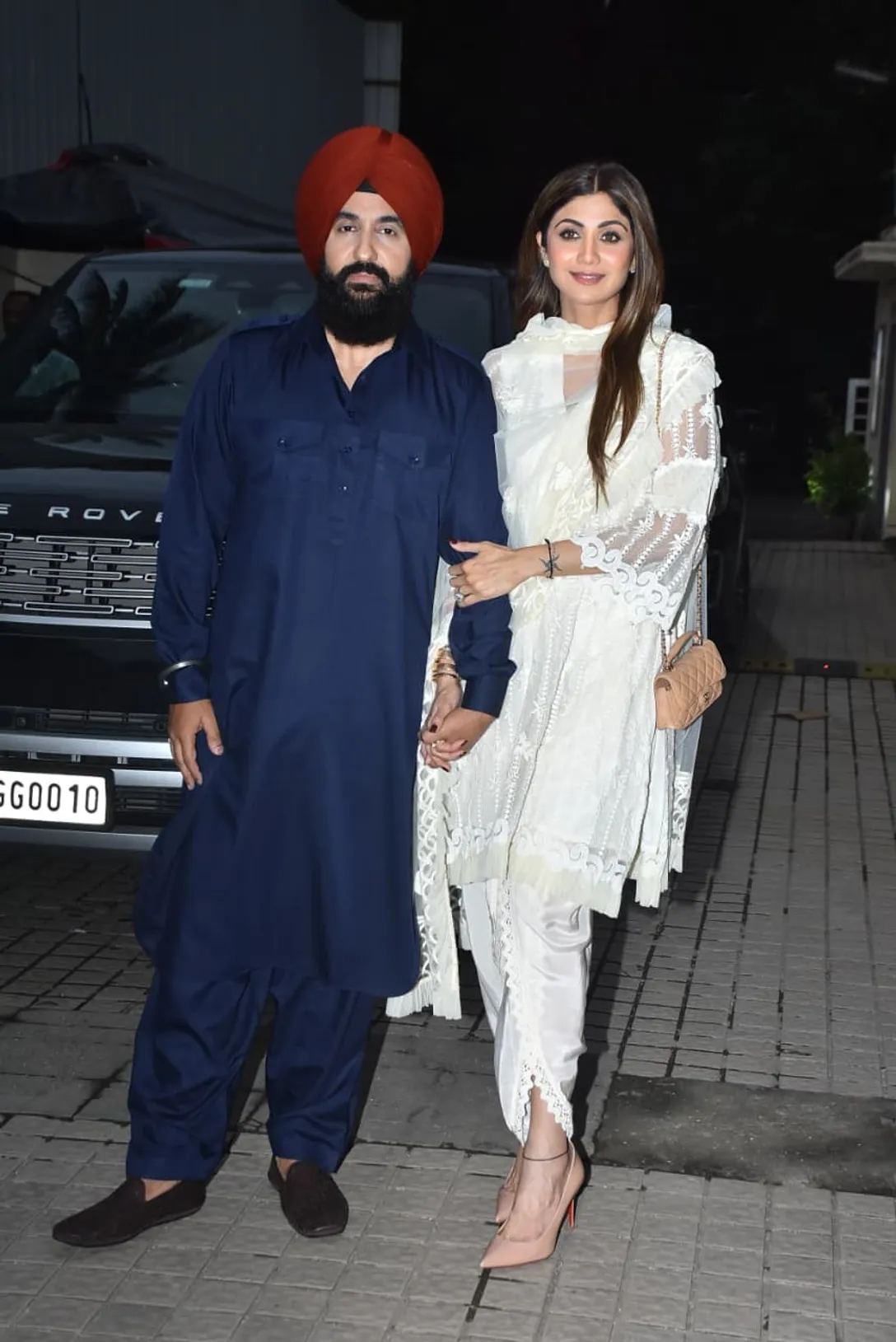 Raj Kundra's Punjabi look was seen in the special screening of 'Meher'. He wore a blue Pathani suit. Shilpa looked like an Apsara in a white suit.