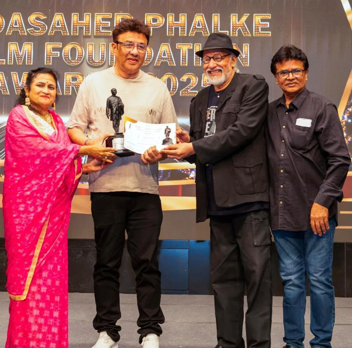 Anu Malik gets his DPFF Award on stage by Bob Brahmabhatt and Ashfaque