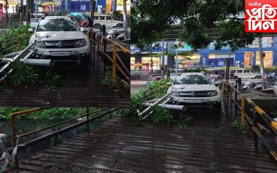 মহানগৰীত ভয়ংকৰ কাণ্ডঃ গাড়ীৰ ওপৰত বাগৰি পৰিল ইলেক্ট্ৰিক খুঁটা