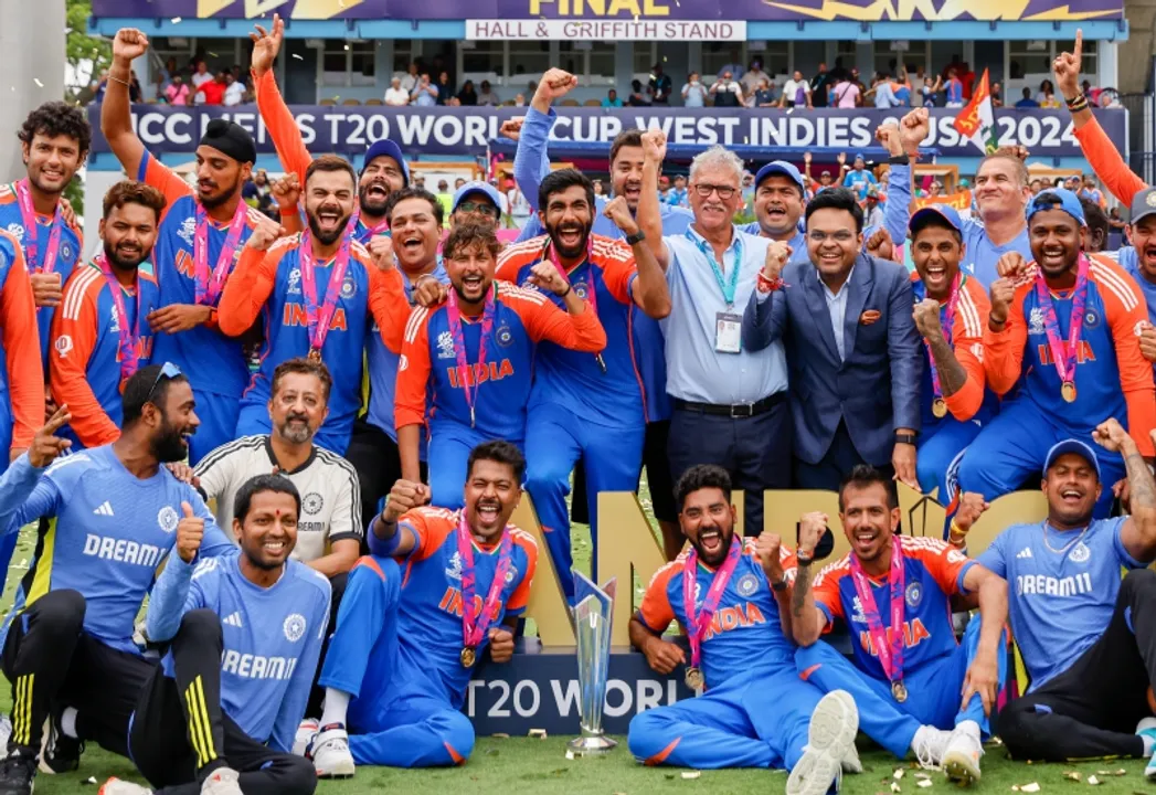  Barbados : Players of team India pose with the tropy after India won the ICC Men's T20 Cricket World Cup Final match against South Africa at Kensington Oval in Barbados on Saturday, June 29, 2024. (Photo: IANS) 