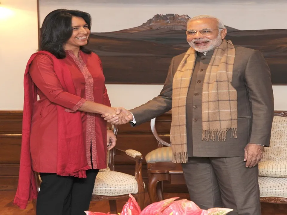  New Delhi: US Congresswoman Tulsi Gabbard calls on Prime Minister Narendra Modi in New Delhi, on Dec 17, 2014. (File Photo: IANS/PIB) 