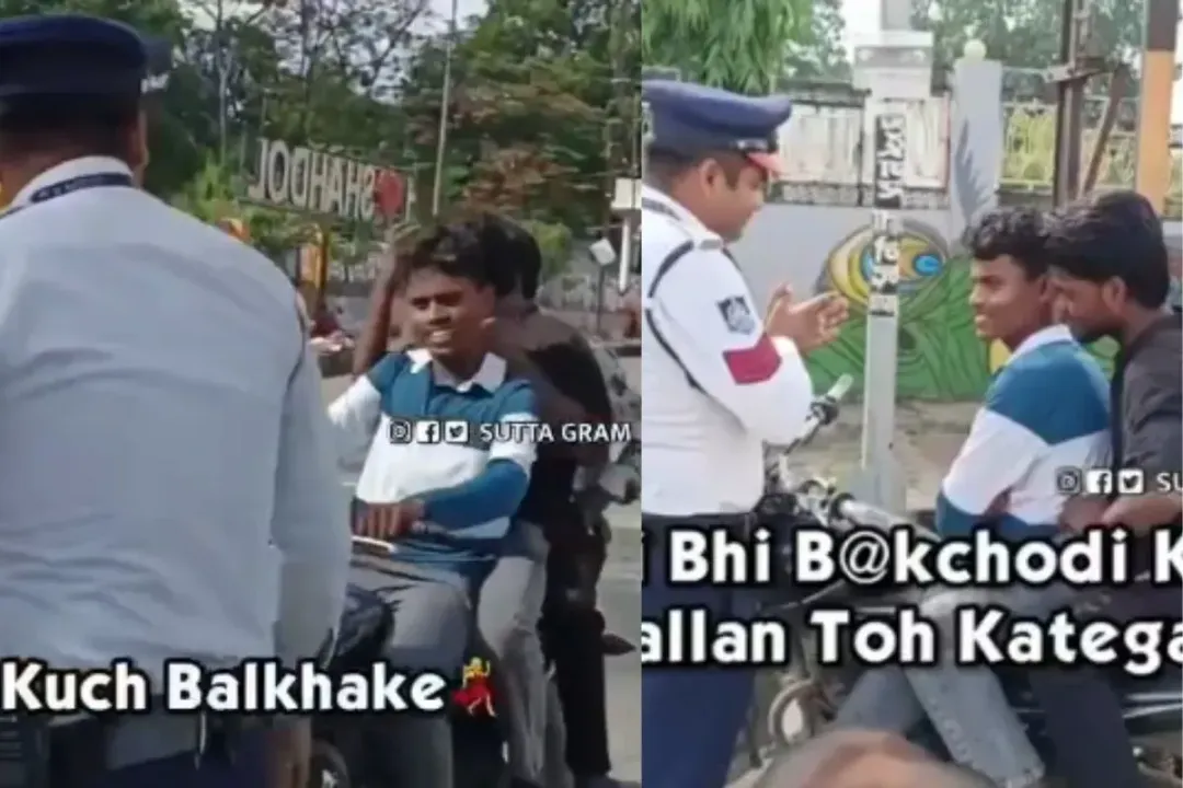 Traffic cop issuing challan to boys