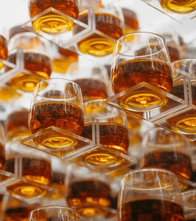 A picture of multiple glasses filled with rum to depict the best rum in India, the growing popularity of premium rum brands India as well as craft rum India to showcase the best rum for gifting in India 2025