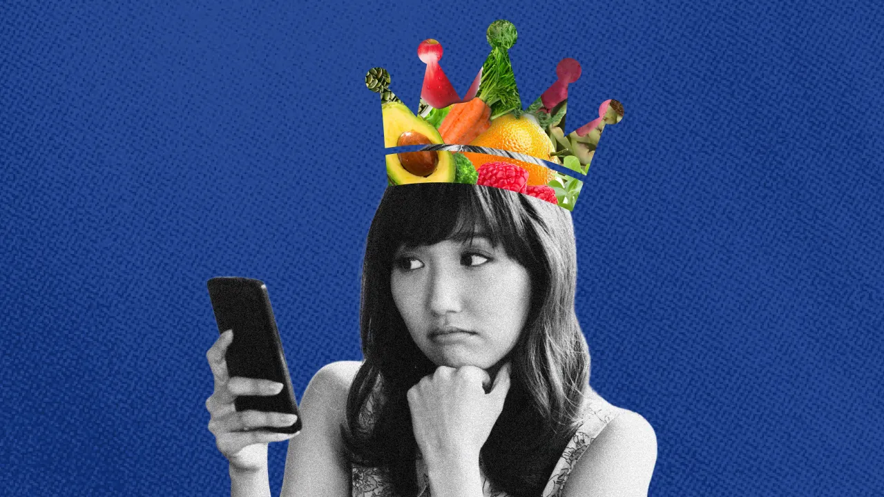  A woman's black and white cutout against a blue backdrop with a crown of fruits and veggies on her head, suggestive of a high-fibre diet 