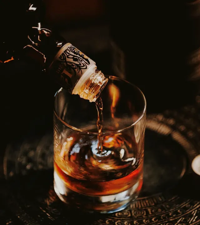 A picture of a drink being made using premium bitters brands to show how the usage of cocktail bitters in India has become common as bitter acquire luxury cocktail ingredients status with craft bitters India.