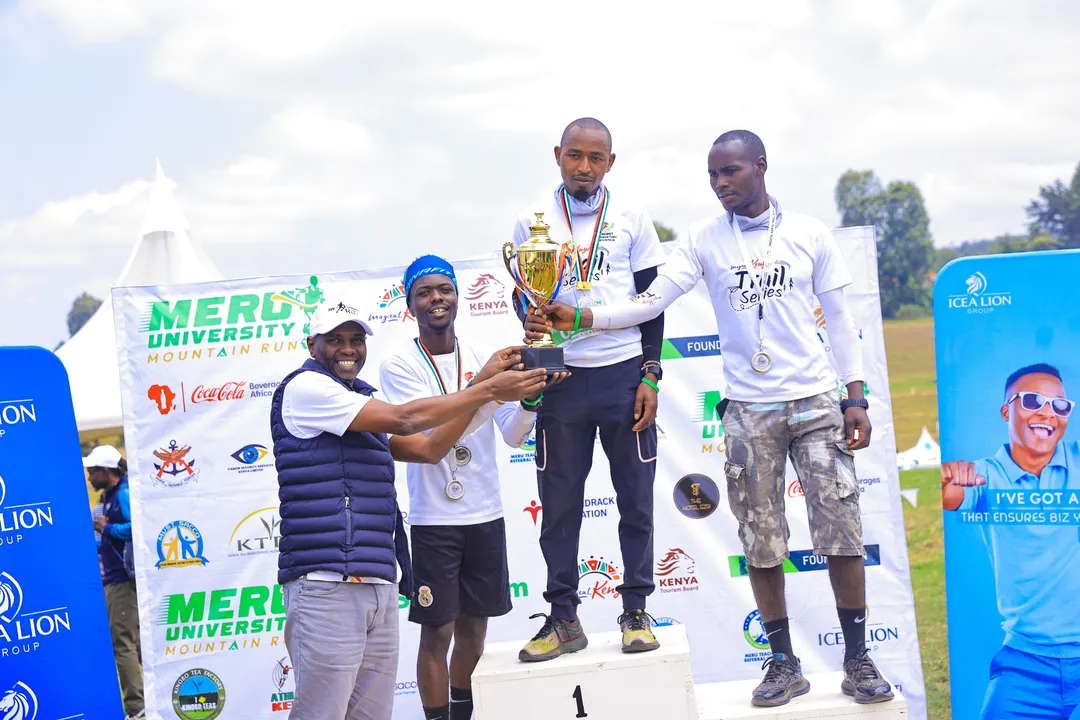 The Corporate team category winners at the 2025 Meru University of Science and Technology Mt Kenya Mountain Run, Team Magical Kenya receive their trophy from the KTB Ag CEO Allan Njoroge