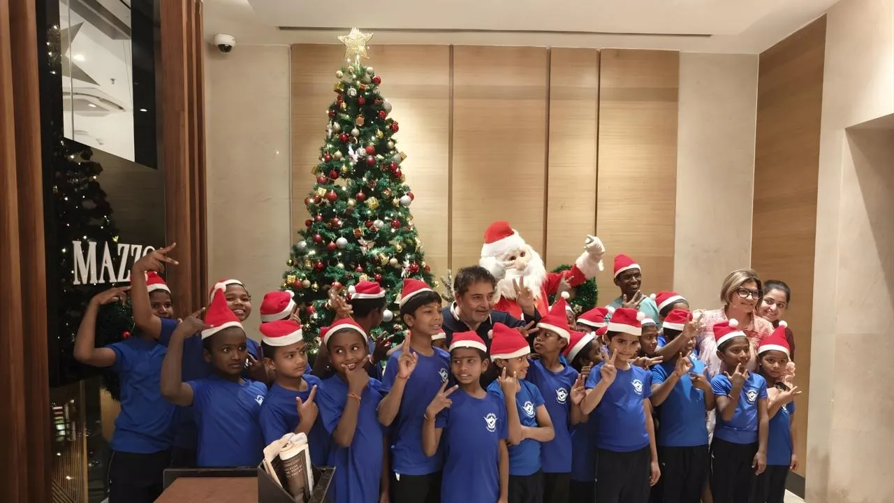 Tree lighting ceremony with children from Aashri Society NGO
