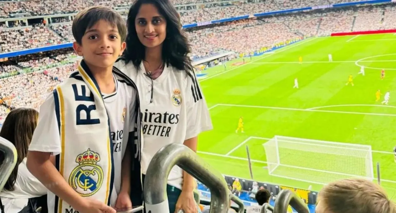 actress shalini ajith kumar and son aadvik cheering in the gallery for real madrid