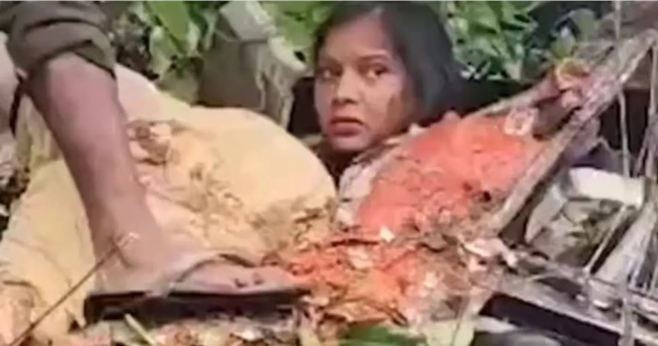  ଗଛ ତଳେ ପଡ଼ି ଛଟପଟ ହେଉଥିଲେ ମହିଳା ; ଭିଡିଓ କରୁଥିଲେ ଦେଖଣାହାରି