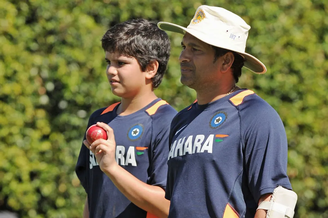  Indian batsman Sachin Tendulkar (R), stands alongside his son Arjun (L), as they watch a nets practice session at the Sydney Cricket Ground (SCG) on January 1, 2012. India plays Australia in the second cricket Test starting at the SCG on January 3. RESTRICTED TO EDITORIAL USE - STRICTLY NO COMMERCIAL USE  AFP PHOTO / Greg WOOD (Photo credit should read GREG WOOD/AFP/Getty Images) 