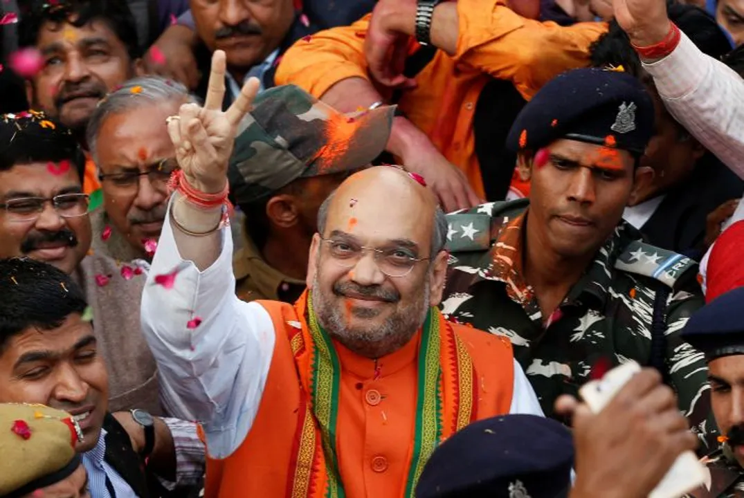  Amit Shah (C) president of India's ruling Bharatiya Janata Party (BJP) gestures as he celebrates with party supporters after learning of the initial poll results inside the party headquarters in New Delhi, India, March 11, 2017. REUTERS/Adnan Abidi - RC16A5523130 