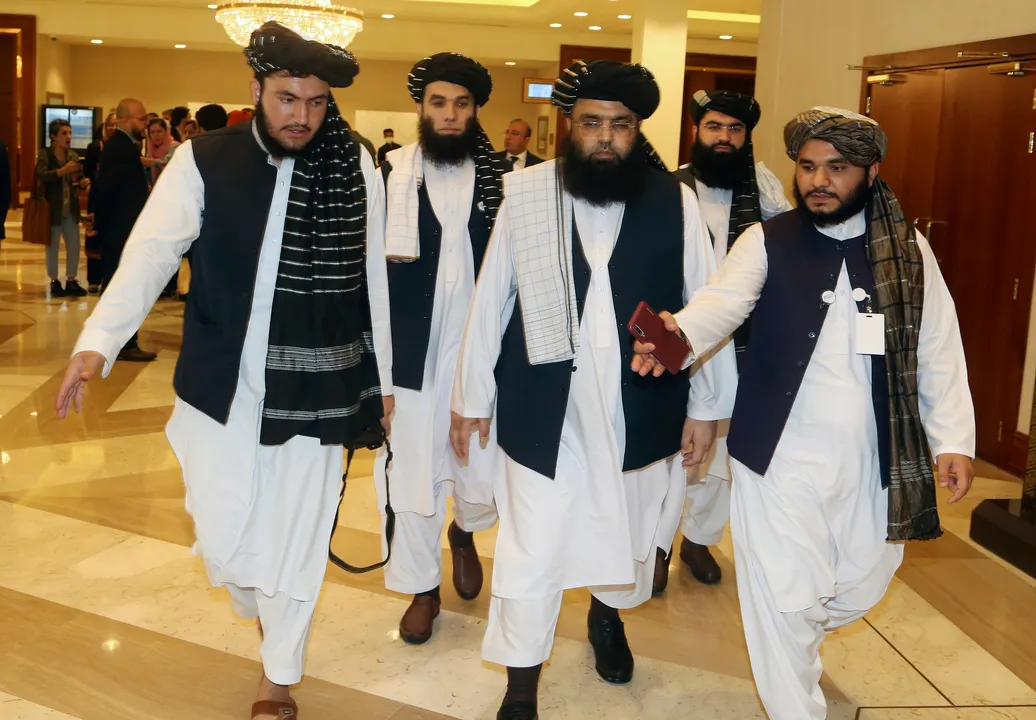  A few members of the Taliban delegation head to attend the opening session of the peace talks between the Afghan government and the Taliban in Doha, Qatar, Saturday, Sept. 12, 2020. (AP Photo/Hussein Sayed) 