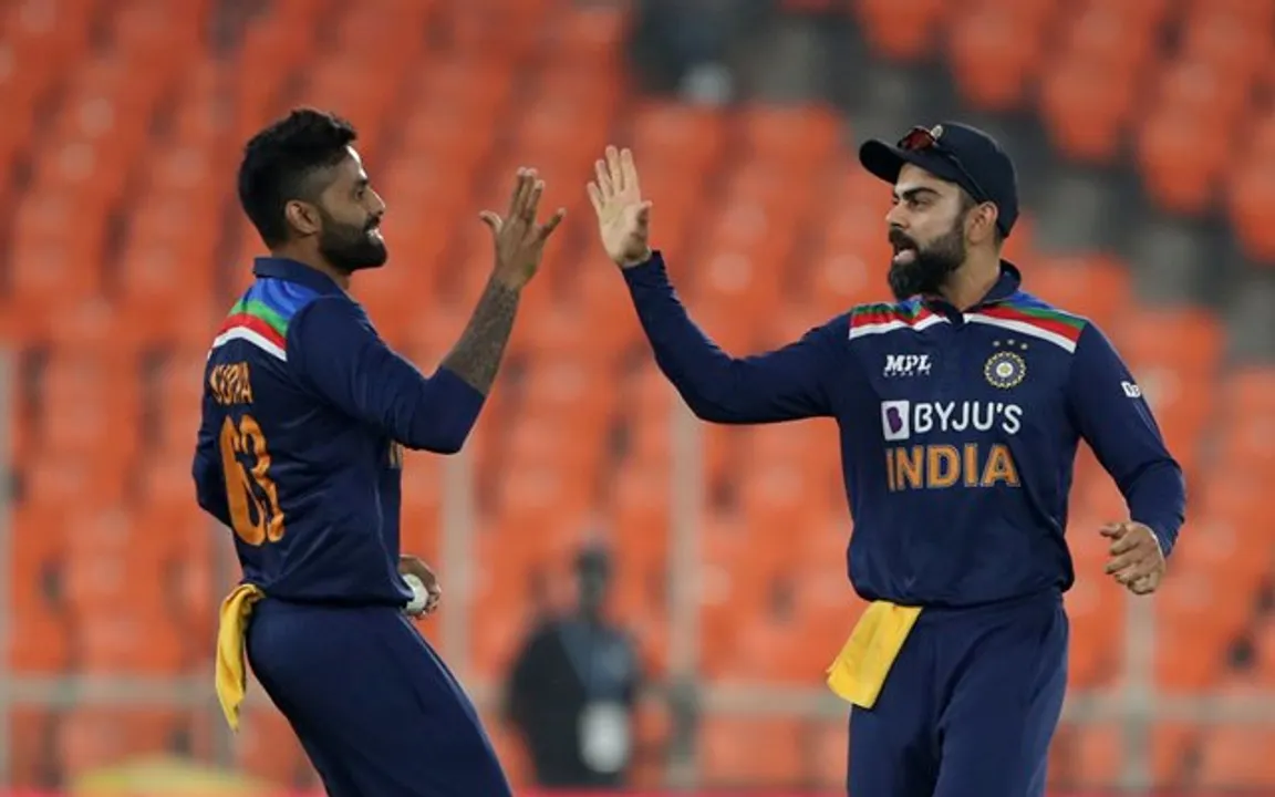  AHMEDABAD, INDIA - MARCH 18: Suryakumar Yadav celebrates with India captain Virat Kohli after catching out Jason Roy of England during the 4th T20 International between India and England at Narendra Modi Stadium on March 18, 2021 in Ahmedabad, India. (Photo by Surjeet Yadav/Getty Images) 