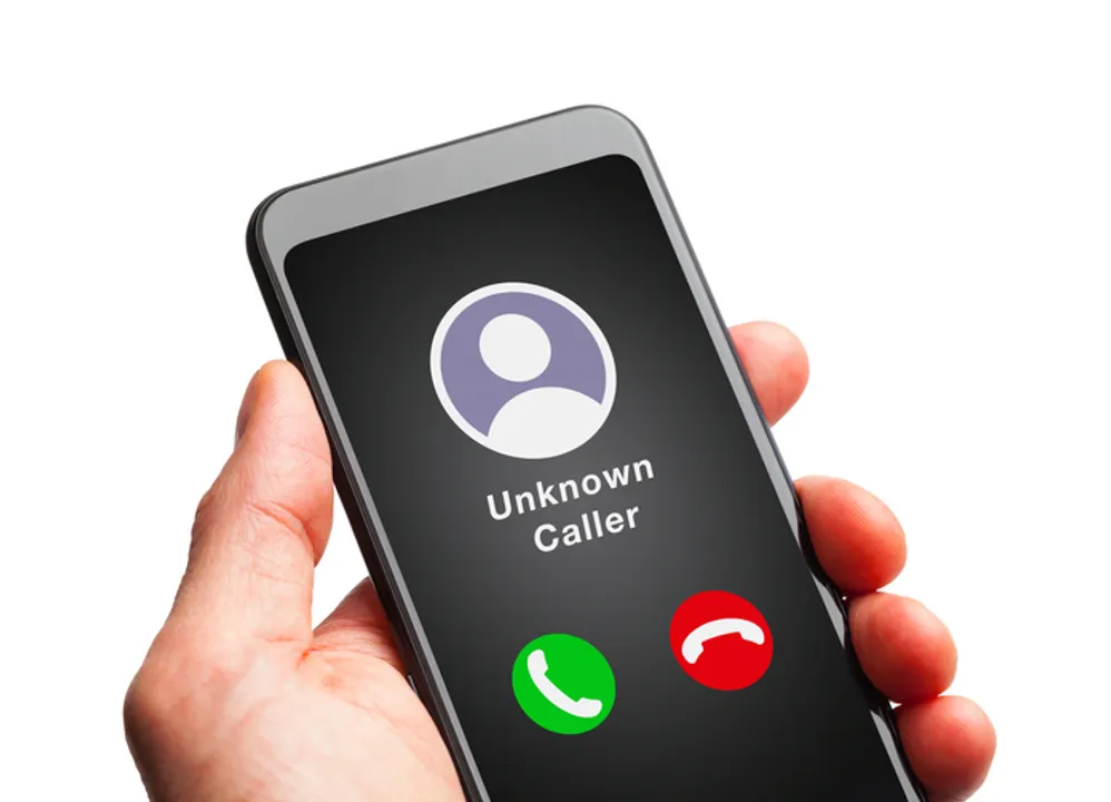  Hand Holding Smart Phone with Unknown Caller. 