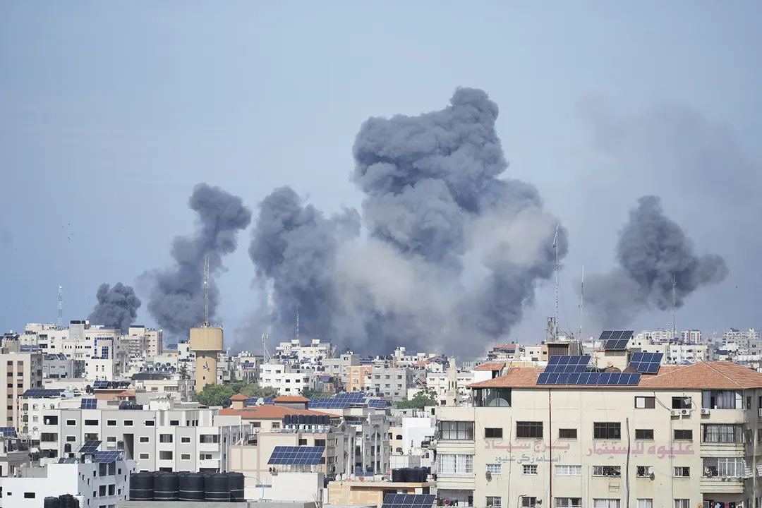  Smoke rises from an explosion caused by an Israeli airstrike in the Gaza Strip, Saturday, Oct. 7, 2023. The militant Hamas rulers of the Gaza Strip carried out an unprecedented, multi-front attack on Israel at daybreak Saturday, firing thousands of rockets as dozens of Hamas fighters infiltrated the heavily fortified border in several locations by air, land, and sea and catching the country off-guard on a major holiday. (AP Photo/Hatem Moussa) 