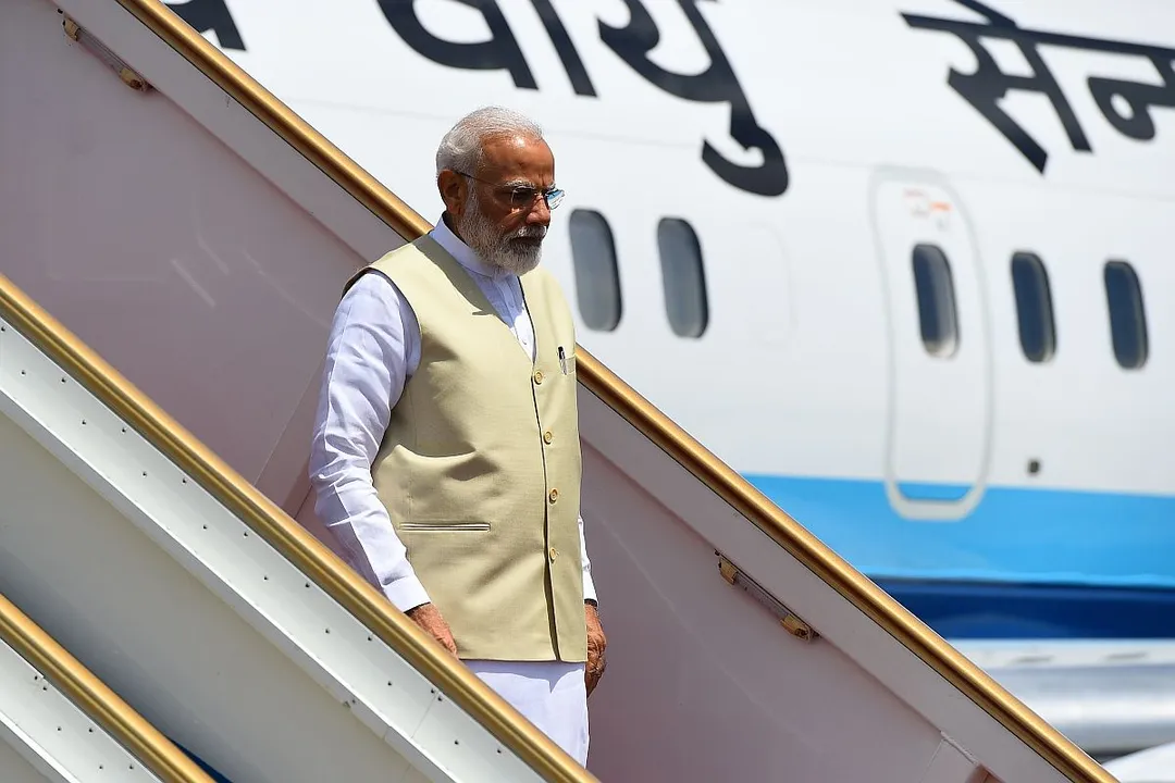  Indian Prime Minister Narendra Modi looks on as he deplanes after arriving at Bandaranaike International airport in Katunayake on the outskirts of Colombo on June 9, 2019. (Photo by ISHARA S.  KODIKARA / AFP) 